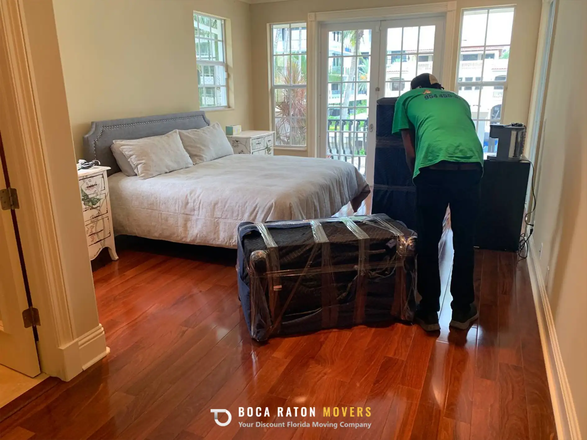 Boca Raton Movers Storage Services Team Members Packing Boxes and Furniture